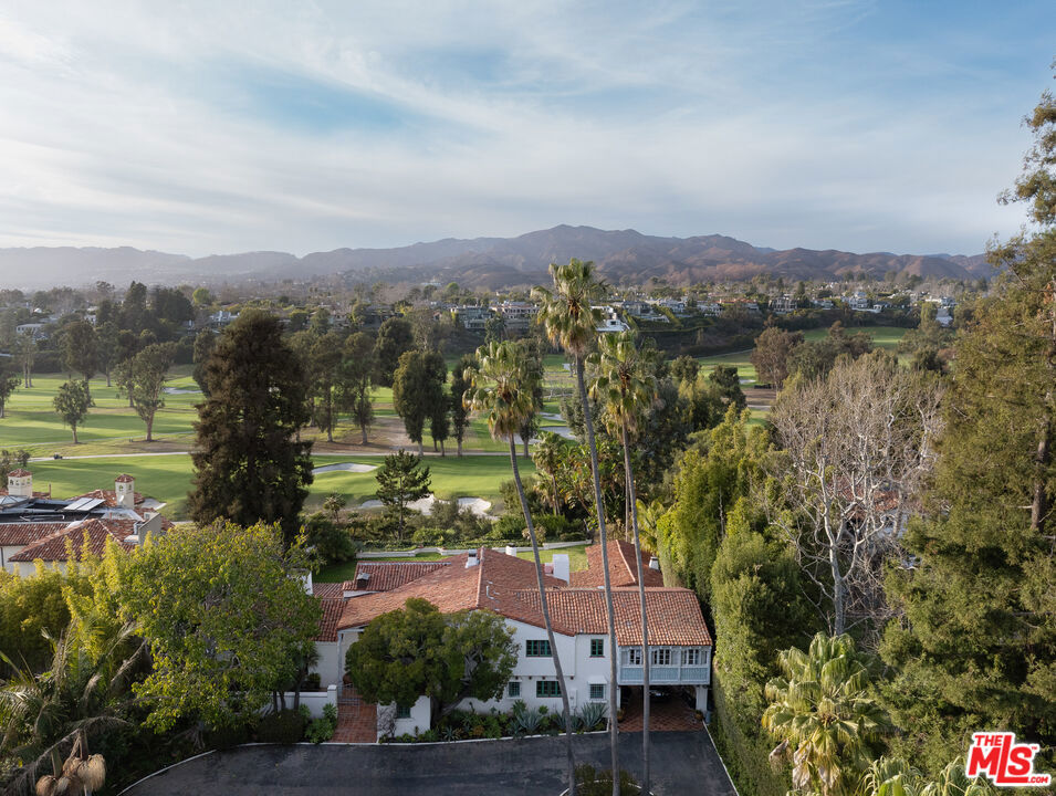 Located in the most distinguished neighborhood of Santa Monica, 1707 San Vicente Boulevard is a testament to historic Mediterranean-style elegance, coupled with the finest in modern luxury. Sitting on nearly an acre of land, San Vicente includes a two-story estate and a guest casita, all perched above The Riviera Country Club with breathtaking, unobstructed views. Complete privacy and security are provided by the gated entrance and hedged driveway leading to the estate. The home's architectural heritage, built by the renowned John Byers, can be felt throughout the property, with its original Malibu tiles, hand-painted ceilings, bespoke carpentry, and seamless blend of outdoor spaces. Outside, the property boasts a glamorous pool, waterfall, and scenic walking path leading to The Riviera Country Club. This one-of-a-kind residence offers a rare opportunity to own a piece of Santa Monica history, where luxury and timeless design come together in perfect harmony.