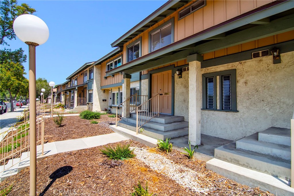 Proud to present this desirable Sunburst Estates II townhome in Reseda. Newer roof & newly completed front landscape project creates a lasting first impression. Inside, new paint, new floors (except stairs), newer exterior door & lower level window and a newer water heater elevate the experience. Spacious living room leads to an amazing oversized private rear patio. Light & bright kitchen features a picture window, refrigerator and a stainless-steel built-in microwave. Large storage closet, ¾ bath & lower-level laundry room with full size side-by-side machines are ideal. Atop the stairs, a huge window frames a beautiful snapshot of the distant majestic mountains. Beautiful new carpet has just been installed throughout the upper level where 3 spacious bedrooms and a full bath completes the interior. Covered extra-wide side-by-side parking is conveniently located right outside your patio. This well-kept complex offers a large gated refreshing pool and ultra-low HOA dues keeping your monthly expenses at a minimum. This prime central valley locale places you close to everything including being just around the corner from a beautiful community park & public library…..Don’t miss!
