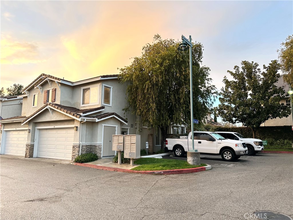 Location! Location! Location! Ready to move in! **Refrigerator, washer & Dryer are included !! This terrific end-unit townhome in the Montana community within Valencia's desired Northbridge neighborhood. This unit has updated flooring(brand new), freshly painted and a cozy double-sided fireplace. The kitchen, living, dining, powder room downstairs and family room are all open to one another! The kitchen has a breakfast bar and direct access to the 2-car garage where you'll find the laundry area. The family room has a nice sliding glass door to access your private wrap-around yard. Head upstairs to the main bedroom with an en-suite featuring dual sinks, an updated shower, and a walk-in closet. There are two additional bedrooms with large closets and an additional full bath that was recently updated as well. This unit is close to the community pool & spa, guest, additional parking , award winning schools.The paseos, bike paths, parks, restaurants, and shopping provide you with access to entertainment, recreation, and activities.