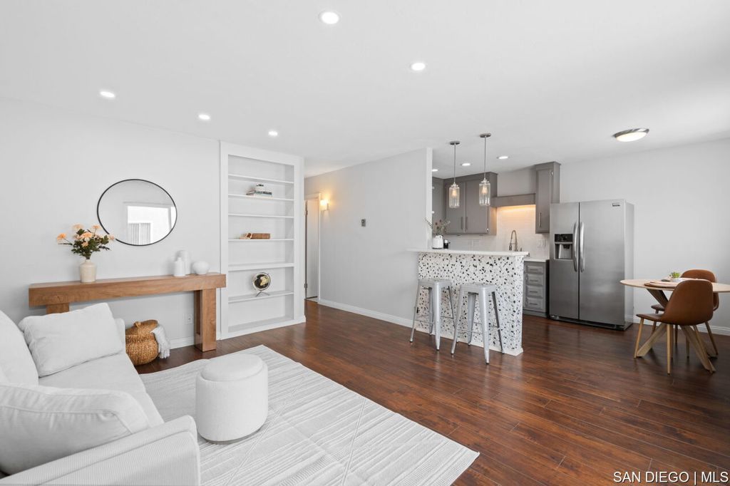 Excellent opportunity to own a home within Normal Heights. Just a few blocks from Adams Ave, this bright and airy 2 bed/1 bath top-floor condo has been updated and freshly painted. Overlooking the pool and a few steps from your own assigned parking spot (137), this unit has no one below nor above you. Interior features quartz counters, stainless steel appliances, a deep single basin sink, and bar seating. Community amenities include a lounge area by the pool, BBQ area with seating, and a community laundry room. Low monthly HOA fee includes landscaping, water, trash service, exterior maintenance and insurance. All within a gated community. Seller is a licensed real estate agent.