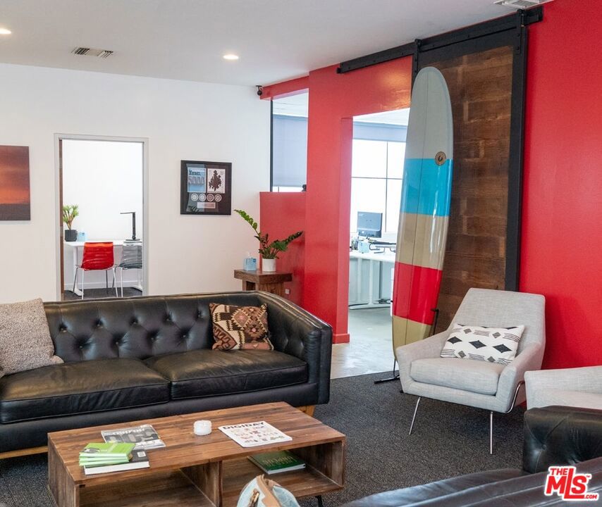 WORK/LIVE SPACE. Open floor plan with with multiple private room on it's perimeter. Secure building. Two blocks from beach.