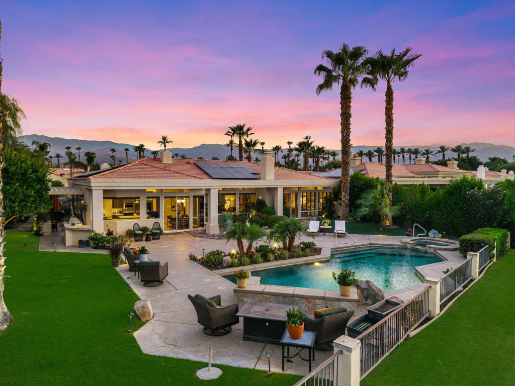 Experience Luxury Living in this Stunning 4 Bedroom-5 Bath Augusta floor plan, perfectly situated on a spacious, oversized lot within Desert Horizons Country Club. Owned 30 panel Solar System and Furnished for your convenience, this home combines elegance and comfort. Enjoy breathtaking Panoramic Views of the serene Lakes and the picturesque 13th Green, creating an idyllic backdrop. The home beautifully features Tumbled Travertine Flooring, 2 cozy Fireplaces, custom cabinetry, and soaring ceilings.The interior is designed for entertaining, with expansive Living, Dining, and Wet bar areas that seamlessly connect. The updated Gourmet Kitchen is a Chef's dream, equipped with warm-finished cabinetry, Quartz Counters, Pantry and Top-of-the-Line Appliances such as Wolfe, Sub Zero, and Miele. The Primary Suite offers a spa-style bath, dual vanities, and a generous walk-in closet, while 2 additional Guest Rooms with en-suite baths provide privacy and convenience. A custom-built office, which can serve as a 4th bedroom, offers a perfect workspace or an additional Guest Room. Step outside to the expansive entertaining Patio where captivating Mountain Vistas and scenic Fairway Views are yours. Enjoy the sparkling Pool and Spa, a custom BBQ area -ideal for relaxing or hosting memorable gatherings. The spacious side yard is landscaped with luscious Fruit Trees, Dining area, perfect for your furry friends and outdoor activities. Completing this stunning property is a 3-car garage with AC, Newer HVAC systems. Your ultimate desert lifestyle.