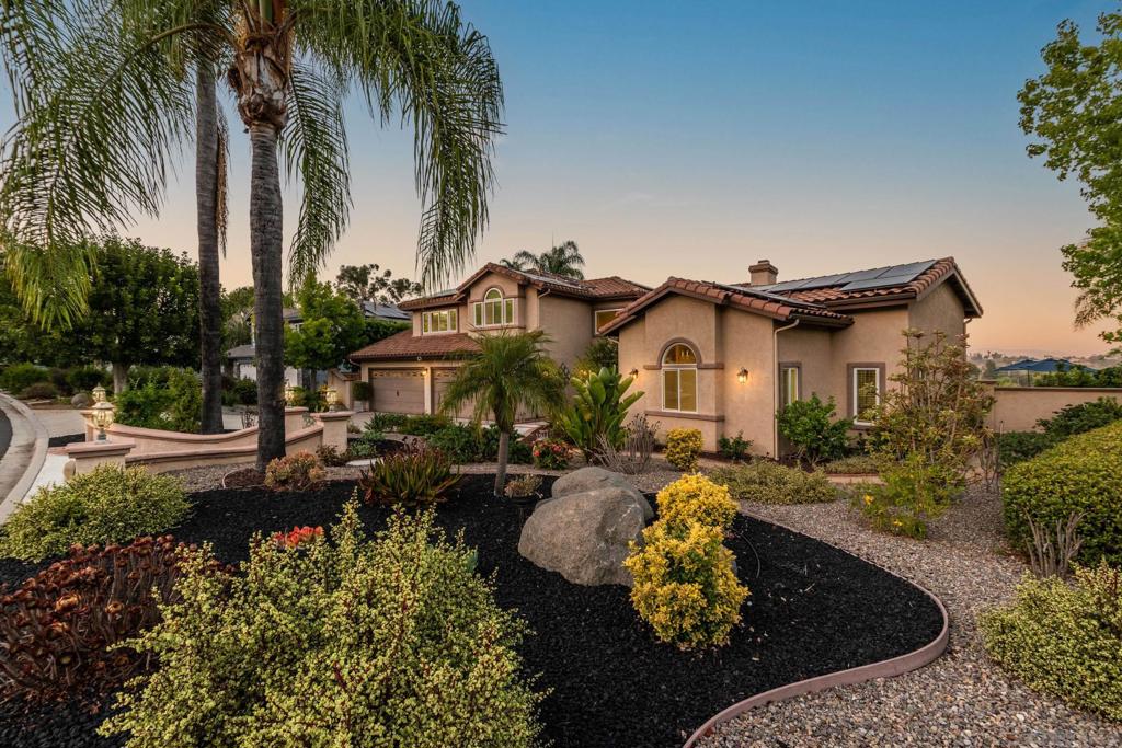 Stunning Upgrades and Spectacular Views! From the moment you step inside, you'll notice the impressive custom renovations throughout this expansive home with over 5 bedrooms—including two primary suites, one of which is downstairs with serene views of the pool and mountains. The kitchen, fully remodeled in 2015, features high-end Bosch appliances (convection hood, range, microwave, and oven), modern recessed/pendant lighting and a spacious redesigned layout centered around a large island w/ seating. The breakfast nook boasts a custom built-in bench with hidden storage. Bedrooms are generously sized, and all bathrooms have been beautifully updated. The home includes copper plumbing, energy-efficient Low-E vinyl windows and sliders, and a striking wrought iron staircase. An oversized 4-car garage complements the 13.6 kW solar system that powers the entire home, including an EV charger. The tiered backyard is an entertainer’s dream—featuring a retiled pool and spa with separate solar heating, an outdoor kitchen, firepit, basketball court, motorized awning, and fruit trees—all set against a backdrop of breathtaking views. Additional highlights include an upgraded security system and a drought-tolerant front yard. Every detail of this home reflects exceptional craftsmanship and thoughtful design.