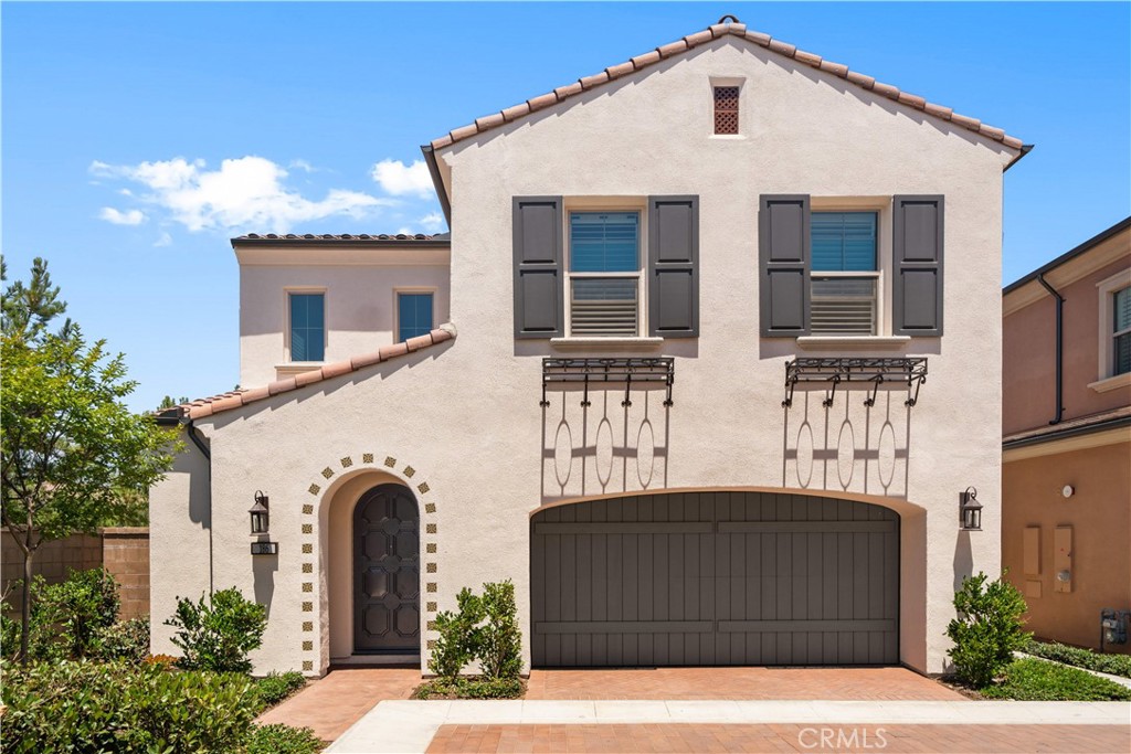 Discover this elegantly upgraded residence in the sought-after Portola Springs neighborhood!
This detached, move-in-ready home showcases over $100,000 in high-end custom enhancements, delivering a perfect balance of comfort and style.
Step inside to a welcoming foyer with a dramatic staircase, direct access to the finished garage, and a convenient guest powder room. The open floor plan highlights a spacious great room, anchored by a chef’s kitchen featuring a generous center island, quartz countertops, Wolf appliances, and designer lighting fixtures. Two sets of bi-fold doors open the living and dining areas to the private backyard, creating a seamless connection for indoor-outdoor entertaining.
The backyard is thoughtfully landscaped with low-maintenance plants as mature privacy hedges, and as an ending unit, the home is filled with natural light. The covered patio with tile floor enhances the sense of continuity.
Upstairs, you’ll find three bright bedrooms, two designer-upgraded bathrooms, and a full laundry room with custom cabinetry. The primary suite feels like a spa retreat, boasting custom floor finishes, dual vanities, and a walk-in shower. The secondary bedrooms offer comfort with plantation shutters and recessed lighting, while the upper level is finished with nice paint and luxury vinyl plank flooring.
Experience modern Irvine living at its best in this thoughtfully crafted Portola Springs residence!
