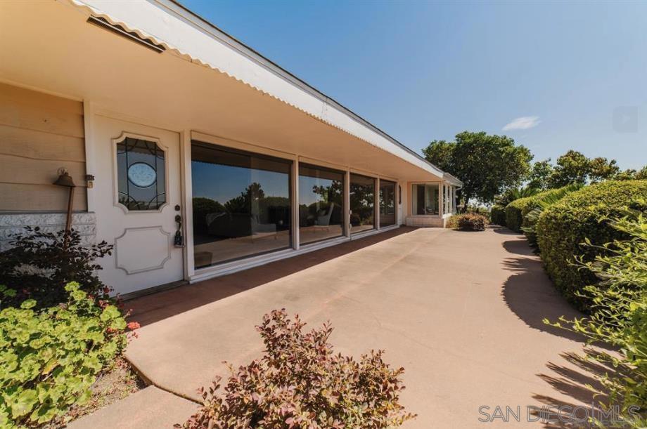 Welcome to the prestigious Mt. Helix area of La Mesa San Diego County! This single-story ranch-style home offers 3 bedrooms, 2 bathrooms, and 2,340 square feet of comfortable living space on a generous 34,412 square foot lot. With this home seated on the west side of Mt. Helix, you'll enjoy sweeping views to the west and south from multiple living areas, including a spacious living room, cozy family room, dedicated dining area, and a versatile bonus space perfect for an office, studio, or playroom. Fresh new carpet has just been installed in each bedroom and the main living area. The home features a standard 2-car garage and an extra-long driveway, providing plenty of parking for guests and room for recreational vehicles or toys. Outdoors, discover a lush retreat filled with vibrant plants, colorful flowers, and an abundance of mature fruit trees — including orange, lemon, lime, avocado, and grapefruit. Whether you're relaxing in the peaceful porch overlooking San Diego County or entertaining under the sunset skies, this property offers unmatched privacy and natural beauty. Is safety or privacy a concern? This property is one of very few on Mt. Helix that is within a the private (only 5 total homes) gated community of La Cruz Place. All of this just 10 miles from Mission Valley and less than 20 miles from the beach! A rare combination of land, layout, location, and livability — don’t miss the opportunity to make this Mt. Helix gem your own.