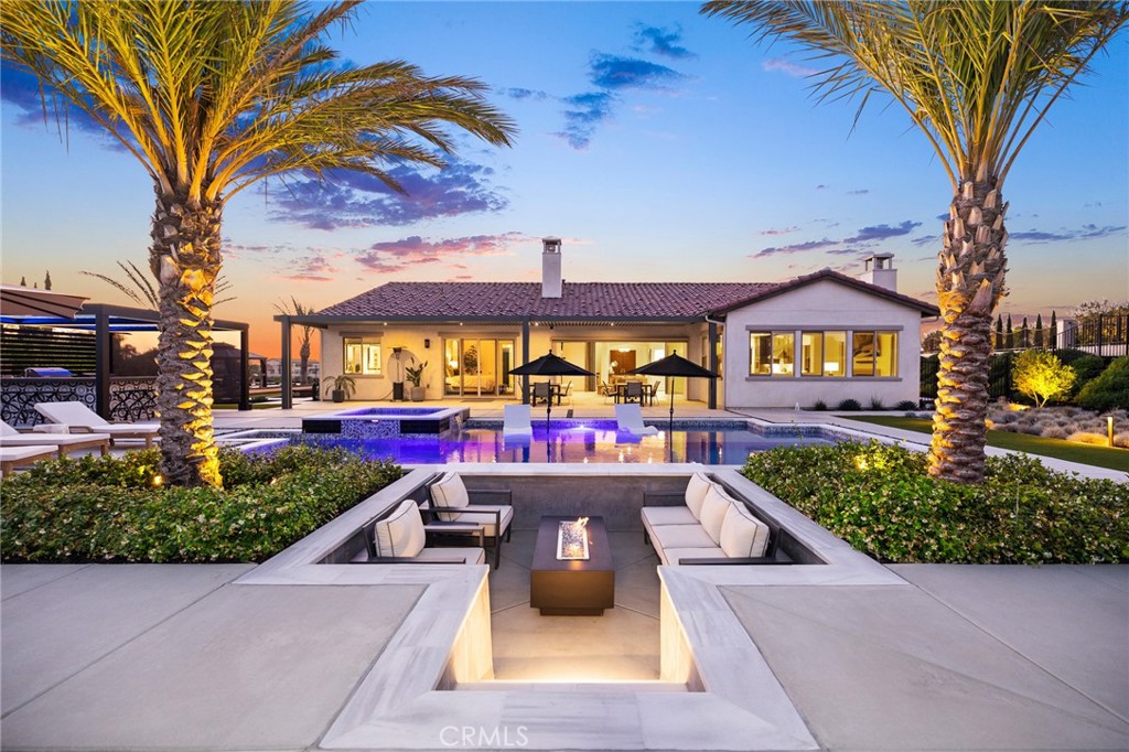 For more info, video and additional photos visit the website - - https://41783valenciaway.com/idx. - - - Welcome to one of the newest built luxury custom homes in the prestigious Groves community of Temecula Wine Country. Situated on 2.5 plush landscaped acres, this single-story 4,096 sq ft estate blends modern design, top-tier finishes, and exceptional outdoor amenities. There are 4 bedrooms, 4.5 baths, plus an office, a wine room as well as a bonus room or kids retreat.
The gourmet kitchen is built to impress with soft-close cabinetry, KitchenAid appliances, a Sub-Zero refrigerator, walk-in pantry, and a separate butler’s pantry. Bifold panoramic doors open into a spacious California room with an automatic screen, creating seamless indoor-outdoor living. The great room and main living areas feature an open-concept layout ideal for entertaining.
The primary suite offers a spa-inspired retreat with a super shower, complete with a rain head and custom tile. Throughout the home, you’ll find thoughtful details and upgraded construction including 2x6 framing, dual tankless water heaters, LifeSource whole-house water filtration, and energy-efficient design.
Car enthusiasts will love the oversized 4-car garage, finished with epoxy flooring and equipped with a 220V plug ready for your EV charger.
Step outside to enjoy a salt water pool and spa with a sunken fire pit, completed in 2023. The outdoor amenities continue with plush landscape, a bocce ball court, horseshoe pit, lemon tree, and a fully equipped BBQ area featuring LED lighting, a custom motorized screen, and a louvered roof that opens and closes at the push of a button, which all overlooks an amazing Mountain View.
This is a rare opportunity to own a modern, move-in-ready estate in one of Temecula’s most exclusive gated communities. No detail was overlooked, this home is the complete Wine Country lifestyle package.