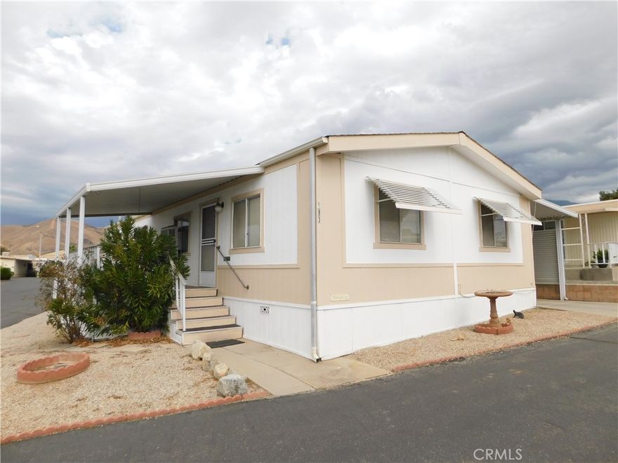 $$$ REDUCED $$$ ~BEAUTIFUL HOME ON A CORNER LOT SITUATED IN YUCAIPA'S HIGHLY DESIREABLE 55+ COMMUNITY OF CRESTVIEW MOBILE ESTATES~LOW SPACE RENT ONLY $390!~NEW COMP SHINGLE ROOF IN 2024 WITH 50 YEAR TRANSFERABLE WARRANTY AND NEW WATER HEATER IN 2025!~HUGE LIVING AREA OPEN TO FULL SIZE DINING AREA WITH BEAUTIFUL BUILT-IN OAK CABINETS!~GORGEOUS KITCHEN WITH GRANITE COUNTER TOPS, STAINLESS STEEL SINK, AND CABINET/COUNTER SPACE GALORE!~FRIDGE INCLUDED!~ H U G E KING SIZE PRIMARY BEDROOM WITH TONS OF BUILT-IN STORAGE/CLOSET SPACE AND HUGE WALK-IN CLOSET!~PRIMARY BATHROOM WITH UPGRADED VANITY, WALK-IN SHOWER WITH ENCLOSURE, AND LINEN CLOSET~QUEEN SIZE SECOND BEDROOM~SECOND BATHROOM WITH TUB/SHOWER AND UPGRADED VANITY~SEPARATE LAUNDRY ROOM WITH MORE STORAGE!~WAHSER/DRYER INCLUDED!~2 CAR CARPORT WITH RAMP~SHED~LOW MAINTENANCE YARD~COVERED FRONT PORCH WITH BEAUTIFUL MOUNTAIN VIEWS~CALL FOR A TOUR TODAY, YOU WILL DEFINITELY BE IMPRESSED!~
