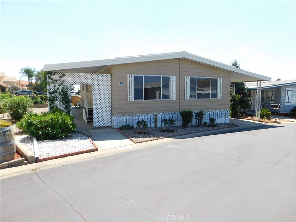 ~~BEAUTIFUL HOME WITH GREAT VIEWS SITUATED ALONG THE PERIMETER OF THE PARK WITH NO NEIGHBORS BEHIND AND ENDLESS VIEWS IN THE FRONT, LOCATED IN YUCAIPA'S HIGHLY REQUESTED 55+ COMMUNITY OF EL DORADO PALMS...LOW SPACE RENT ONLY $509~OVERSIZED LOW MAINTENANCE YARD WITH HUGE CONCRETE FRONT PORCH~~~~~BRAND NEW 30 YEAR METAL ROOF INSTALLED IN APRIL 2020 BY SOUTHWEST HOME IMPROVEMENTS FOR $17,500~RELEVELED PLUS 44 NEW PADS & PIERS INSTALLED IN APRIL 2020 BY SOUTHWEST HOME IMPROVEMENTS FOR $2,500~PAINTED EXTERIOR IN AUG 2023 FOR $2,800~~~~~ LARGE BRIGHT LIVING ROOM WITH MOUNTAIN VIEWS~FULL SIZE DINING ROOM WITH BUILT-IN HUTCH AND NEW LIGHT FIXTURE~SEPARATE SPACIOUS FAMILY ROOM~OPEN KITCHEN WITH FRESHLY PAINTED CABINETS...FRIDGE INCLUDED~PRIMARY BEDROOM IS KING SIZE WITH WALK-IN CLOSET~PRIMARY BATH HAS TUB/SHOWER WITH ENCLOSURE~GUEST BEDROOM IS QUEEN SIZE WITH WALK-IN CLOSET~GUEST BATH WAS REMODELD IN 2015 WITH FULL SIZE WALK IN SHOWER WITH RAIN GLASS ENCLOSURE, NEW VANITY, TOILET AND FLOORING~LAUNDRY ROOM OFF THE KITCHEN...WASHER & DRYER INCLUDED~2-3 VEHICLE CARORT~2 SHEDS~***CALL FOR A TOUR***