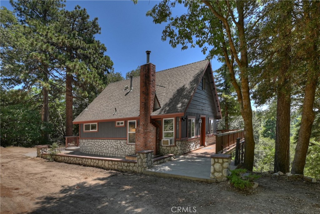 This home is a hidden jewel completely remodeled down to the studs in 2021 and provides room to play, room to breathe, and room to expand on over 1.5 breathtakingly beautiful acres.
The interior boasts a fresh, airy, and modern aesthetic. The efficient floor plan offers the main floor with level entry, bedroom, full bath, kitchen with ample cabinets, stainless appliances, quartz countertops, & dining and living areas with a wood stove insert in the fireplace. A spiral staircase leads to the lower level featuring a secondary living area with an electric fireplace, laundry (large capacity washer and dryer included), spacious bedroom & additional full bath (complete with a view of the forest and mountains from the shower).
With no immediate rear neighbors, enjoy exceptional privacy and majestic views from the expansive (approximately 1,100 square feet) upper & lower decks facing south with excellent sun exposure (the home is well situated for solar). The decks were newly built and issued certificates in 2021 as part of the remodel, and they have just been refreshed with routine maintenance and fresh stain.
The grounds are like your very own park in the forest, including three tree swings and views spanning the treetops and open sky from Lake Gregory to Mt. Baldy all the way to the Pacific Ocean and Catalina Island! There is ample parking for four cars, and the potential for even more. Enjoy the grounds in their natural state, or use as your canvas to bring your landscaping dreams to life.
Situated on a private portion of Sunset View Road just a few hundred feet from the public portion of Sunset View Road (which is one of the first streets to get plowed and ends in a cul-de-sac that offers additional, easy parking). In one direction, walk to the Twin Peaks community center, ball field, and dog park in less than ten minutes. Roughly the same distance in the other direction is an entrance to the Sawmill land preservation area and its beautiful, secluded hiking trails.
There is no homeowner’s association, but there is a small neighborhood water association that provides water to the member homes through a community well supplied through an underground aquifer with fresh, clean, and delicious water for a flat rate of approximately $50 per month!
This combination of a recently remodeled home, land, privacy, and stunning views is a rare find and is offered fully furnished with all major appliances. Make it your dream full-time home or mountain getaway today!