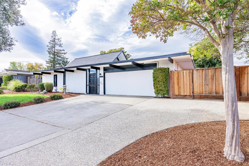 Nestled on a calm and quiet street, this timeless Eichler designed home sits right on the border of Cupertino and Los Altos. Just a short stroll from Top-Rated Cupertino schools and the Homestead Crossing Shopping Center, where you can enjoy a coffee or check off your grocery list with ease. Before you even step inside, a striking atrium welcomes you, connecting the homes living spaces with classic mid-century style. The open-concept interior is filled with natural light thanks to soaring windows and dramatic vaulted ceilings. Radiant slab heating and a cozy fireplace in the living room ensures comfort year-round. The spacious kitchen/family room combo features name-brand appliances, granite countertops, ample cabinetry, pantry and right beside it a bonus laundry room. All bedrooms are generously sized with their own closets, and the peaceful primary suite includes a large walk-in closet and full en-suite bathroom. Additional highlights include a two-car garage and a beautifully landscaped backyard with matures trees an a large side yard with an overhang. Perfectly positioned near major Silicon Valley tech hubs, Apple, Google, and Meta, with quick access to highways 85 and 280. A rare find that's been in the same family for four generations, this one will go FAST!