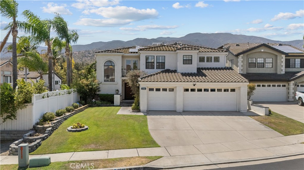 Welcome to the prestigious Sierra Del Oro community—this resort-style executive residence is perfectly situated on a quiet cul-de-sac in one of Corona’s most desirable neighborhoods. This impressive 4-bedroom, 4-bathroom home offers a blend of modern elegance, comfort, and an entertainer’s luxury.
Step inside to soaring cathedral ceilings in the formal living and dining rooms, beautifully accented with upgraded Maximo white tile flooring. A dual-sided fireplace, plantation shutters throughout, and recessed lighting create a warm yet sophisticated ambiance.
The heart of the home is the modern chef’s kitchen, featuring Galaxy Black countertops, sleek designer cabinetry, upgraded stainless-steel appliances, and abundant storage. The adjoining breakfast nook and family room flow seamlessly together, perfect for both entertaining and everyday living.
The first floor also includes a bedroom with a full bath, a convenient laundry room, and an enclosed garden patio with upgraded doors—a private retreat for relaxation at your leisure.
Upstairs, the executive-style primary suite boasts a fireplace, a cozy private balcony with majestic mountain and rolling hill views, and a spa-inspired bathroom with a soaking tub, walk-in shower, and large walk-in closet. Two additional bedrooms upstairs each feature their own private en-suite baths, providing comfort and privacy for family or guests.
The resort lifestyle continues outdoors with an entertainer’s paradise: a sparkling pool and spa, gas fire pit, and a spacious garden patio area—perfect for hosting gatherings or enjoying tranquil evenings under the stars.
This resort-style executive home offers the very best of Corona living—luxury, comfort, and breathtaking views. Don’t miss your opportunity to make it yours.
