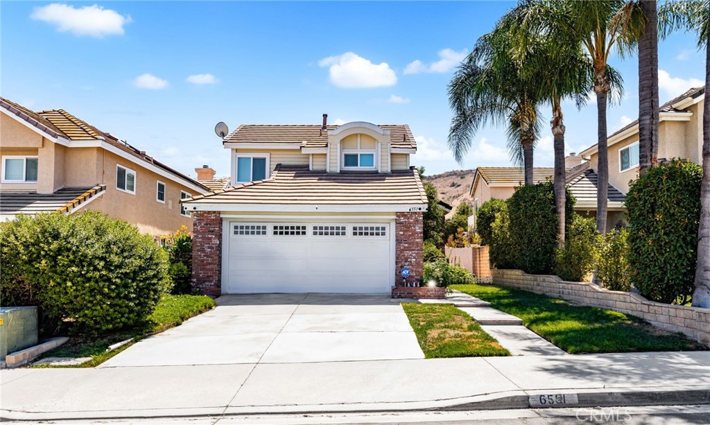 Pride of ownership shows in this beautifully maintained 3-bedroom, 2.5-bathroom home located in the sought-after community of Butterfield Ranch in Chino Hills. Nestled on a quiet street with no HOA, this property offers comfort, charm, and convenience. Step inside to a spacious living area featuring soaring vaulted ceilings and a gorgeous fireplace that creates a warm, inviting atmosphere. The well-appointed layout includes a bright kitchen and open dining area, perfect for everyday living and entertaining. Upstairs, the primary suite boasts its own private retreat with a large deck overlooking the beautifully landscaped backyard — ideal for morning coffee or evening relaxation. The front and back yards are fully landscaped and offer a perfect blend of curb appeal and outdoor space for gatherings, gardening, or play. Additional highlights include an attached garage, plenty of natural light, and a peaceful neighborhood setting close to top-rated schools, parks, shopping, and dining. Don’t miss this opportunity to own a turn-key home in one of Chino Hills’ most desirable areas!