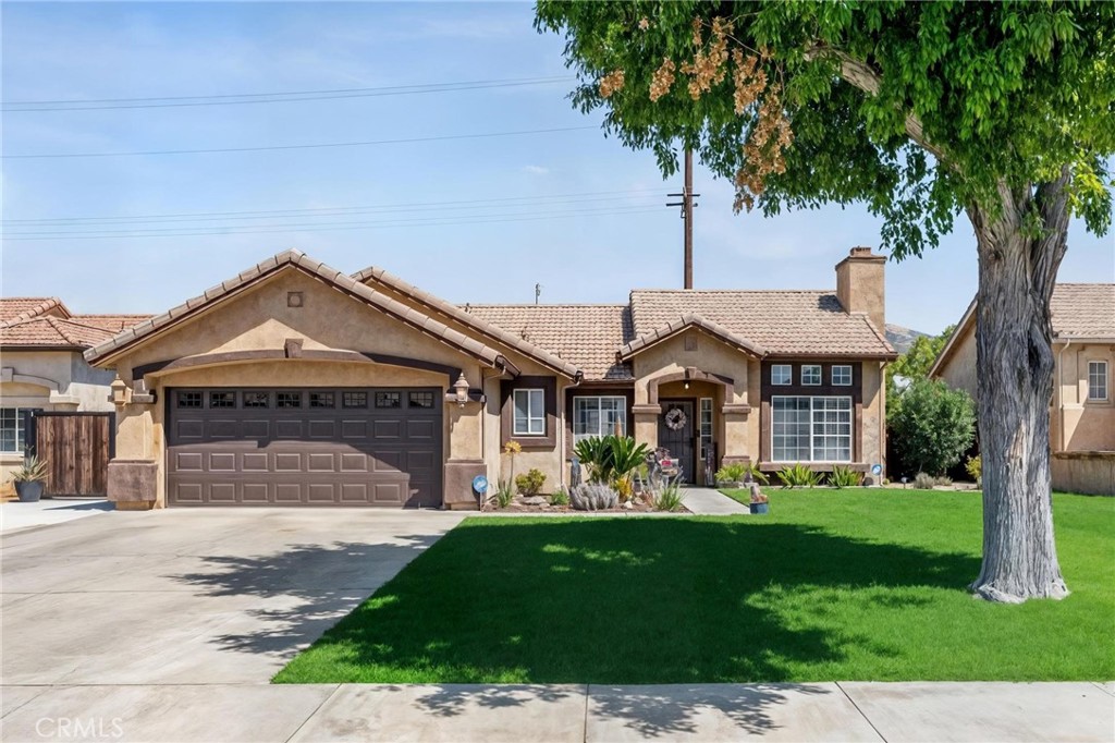 Welcome to this well-maintained 3-bedroom, 2-bathroom single-family home located in a quiet San Jacinto neighborhood, just minutes from local schools, parks, and shopping. Perfect for first-time buyers or anyone looking for a comfortable and affordable home! Step inside to a bright and inviting living space, with an open layout that flows seamlessly into the dining and kitchen areas. The kitchen offers plenty of cabinet space and natural light, making meal prep a breeze. Enjoy outdoor living year-round with a covered patio, perfect for relaxing, barbecuing, or entertaining family and friends. The backyard has plenty of potential for gardening, play space, or even future upgrades.