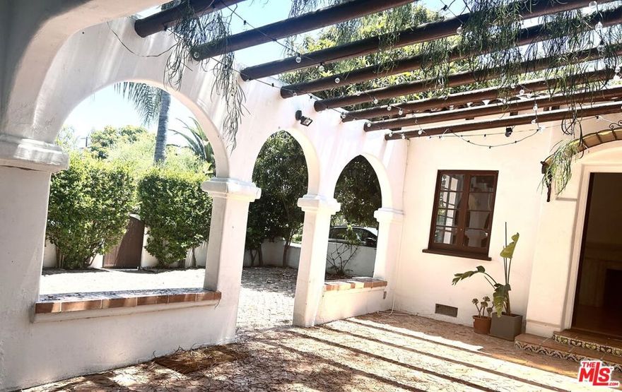 Introducing a Spanish home, in the heart of the city! This property is composed of two separate structures- one in the front and one in the back. The Front Home features 3 bedrooms and 3 bathrooms, one story. The separated structure nested in the back of the lot features 2 expansive bedrooms, 2-1/2  bathrooms, 2 stories tall. Spacious front yard, elegant patio & luscious backyard garden. Private and secure- Tall Block walls and soaring high natural hedges surrounding the property. Stainless steel appliances, Granite and tile in the kitchen. Hardwood floors throughout. Fireplace and big windows in the living room. Separate dining room with historic beams in the ceiling. Central A/C & heating. Ideal for Roommates that want to live comfortably! Location Location Location!!! Walking distance to local cafes, shops, Beverly Center and the Grove. Tenants pay all utilities and verify all square footage to their satisfaction.