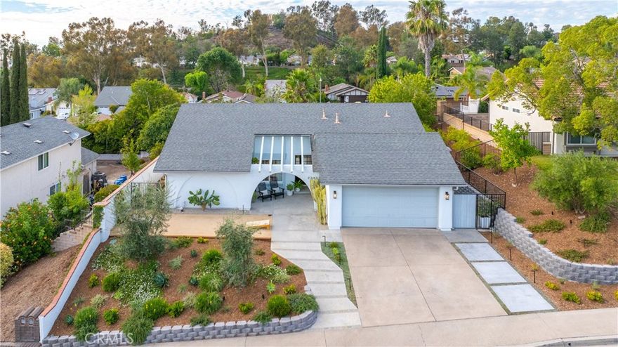 Stunning Single-Level Mission Viejo Home with Upgrades Galore and Lake Access.  Nestled in the highly sought-after Castille neighborhood, this single-level home offers fabulous curb appeal and a host of recent upgrades, making it model-perfect and move-in ready. The spacious floor plan features four bedrooms and two remodeled bathrooms, providing comfort and style for modern living. Upon entering, the vaulted ceiling and recessed lighting in the family room create an inviting atmosphere, while the fireplace and French doors leading to the backyard enhance the home's indoor-outdoor flow. The chef's kitchen is a true highlight, appointed with stainless steel appliances, abundant granite counter space, and windows that fill the area with natural light.  The private backyard is a relaxing oasis, featuring a newly plastered saltwater pool with a baja shelf and fountains, a spa, and a partially covered patio area. Over $165,000 in upgrades, including new flooring, baseboards, new master and guest bathrooms, new pool equipment, new gutters, new water heater, new recess lighting, new front Dutch door, new front yard landscaping and lighting, and a full re-piping of the house with PEX, ensure peace of mind.  This home is situated in a convenient location, just steps from two parks, award winning Castille Elementary school, the Oso Creek Trail, Oso Creek Golf Course, and the Mission Viejo YMCA. A significant bonus is the included membership to Lake Mission Viejo, which offers an array of recreational activities like pontoon boats, kayaks, stand-up paddleboards, fishing, and seasonal concerts. This home offers an unparalleled living experience, combining a beautifully upgraded residence with a vibrant community lifestyle.  This home has low HOA fees and no Mello Roos!  It will sell quickly so make your appointment to see it today.