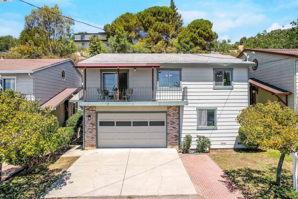 Welcome to this charming home nestled in a quiet Hayward hillside neighborhood. Set back from the street, this spacious residence offers peace, privacy, and breathtaking city and Bay views. Step inside to find new vinyl wood flooring, new carpet, fresh interior paint, modern light fixtures, and updated door hardware throughout. The main level features soaring ceilings and an open concept living and dining area that opens to a view filled deck, perfect for morning coffee or evening sunsets. The kitchen offers freshly painted cabinets, generous counter space, a cozy breakfast nook, and ample storage to keep everything organized. The oversized primary suite includes an en suite bathroom, while a second bedroom and half bath complete upper floor. Downstairs, a large family room with a brick fireplace and bar area invites relaxation and entertaining. The lower level also features a third bedroom with potential for a separate entrance, ideal for rental income, guests, or a private office. It also features a full bathroom and laundry area. The backyard is an entertainer’s dream with a spacious patio and tiered hillside leading up to an upper deck boasting panoramic views of the Bay and city, an unbeatable spot to unwind or watch 4th of July fireworks. Don't miss this unique opportunity!