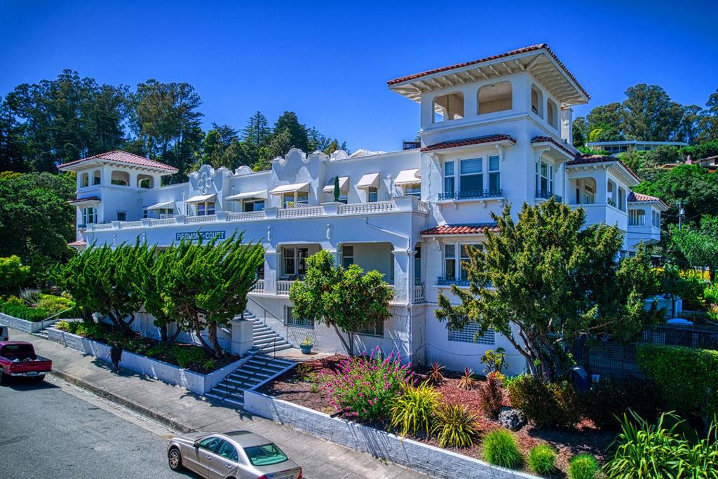 Built in 1912, the historic Piedmont Court is the West Side's Crown Jewel for its exquisite Moorish architecture, charm, community, and conveniences. This amazingly special pied-a-terre is in one of the most sought-after locations in Santa Cruz, a stone's throw from downtown. Under high ceilings, walls of windows in this lovingly, thoroughly renovated home let the light stream in over gleaming wood floors throughout. Overlooking the pleasant courtyard and fountain, with no common walls, find privacy at your fingertips. The fabulously updated, modern, efficient kitchen with stainless Superiore gas range, oven, and fridge is loaded with cabinets for effective storage. Handsome, built-in rich wood shelves, cabinets and a desk line the hallway to the large bedroom adding more functionality. Dues include all utilities except phone and property taxes. Who needs a car? Stroll to the popular Abbey cafe, restaurants, theaters, the post office, banks, and the bus line to UCSC and beyond. Amenities include an elevator, guest room, extra storage, the grand lobby and piano, a sunny courtyard, verandas and verdant gardens with sitting areas, a workshop, bike storage, garages, optional activities, and much more. One resident must be 55+. Any age can own/invest. One pet allowed. All-cash only.