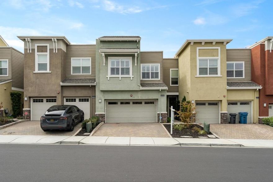 Welcome to 1532 Annie Street, a bright and spacious 3-bedroom, 2.5-bath home featuring modern upgrades and a functional layout. The main level offers an open-concept living, dining, and kitchen area with stainless steel appliances, stone countertops, ample cabinetry, and luxury laminate flooring throughout. Large windows and recessed lighting fill the space with natural brightness, while sliding doors lead to a private paved backyard, ideal for entertaining or outdoor dining. A convenient half bath is also located on the main level. Upstairs, the primary suite features double doors, a large ensuite bath with soaking tub, separate shower, dual-sink vanity, and an expansive walk-in closet. Two additional bedrooms include recessed lighting, large windows, and generous closets. A hallway bath with dual sinks and shower-over-tub, plus a laundry room with washer and dryer, add everyday convenience. Additional highlights include fresh interior updates, new fixtures, abundant storage, and an attached two-car garage that provides both security and functionality. Conveniently located near Serramonte Mall, Westlake Shopping Center, Costco, H Mart, local parks, schools, and Highway 280, this residence blends comfort, modern finishes, and a prime Daly City location.