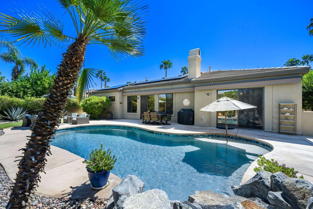 Ready to call this place home! This home is located in the interior of the development. A private courtyard with custom pavers leads you to stylish double-pane glass entry doors, inviting you into a home filled with natural light and an airy, open feel. The spacious living room showcases wood-look porcelain tile flooring throughout, with walls of glass and sliding doors that frame serene views of the backyard and sparkling pool. The social kitchen is perfect for entertaining, granite countertops, stainless steel appliances, and a large pantry. A cozy breakfast area adds to the charm. Two generously sized guest bedrooms share a bathroom with a double vanity and walk-in shower--ideal for family and friends. The expansive primary suite offers direct pool access through sliding glass doors, along with a luxurious bathroom boasting dual vanities, a new shower, a freestanding tub, and a walk-in closet. For added flexibility, the attached casita with its own private courtyard entrance makes an excellent office, guest retreat, or in-law suite. The backyard is your private oasis, beautifully landscaped with citrus trees, complete with an upgraded pool system for easy enjoyment. A bonus room provides space for a gym, office, or creative studio. Additional upgrades include: owned solar system, new window treatments throughout, new kitchen sink and faucet, enhanced landscaping.