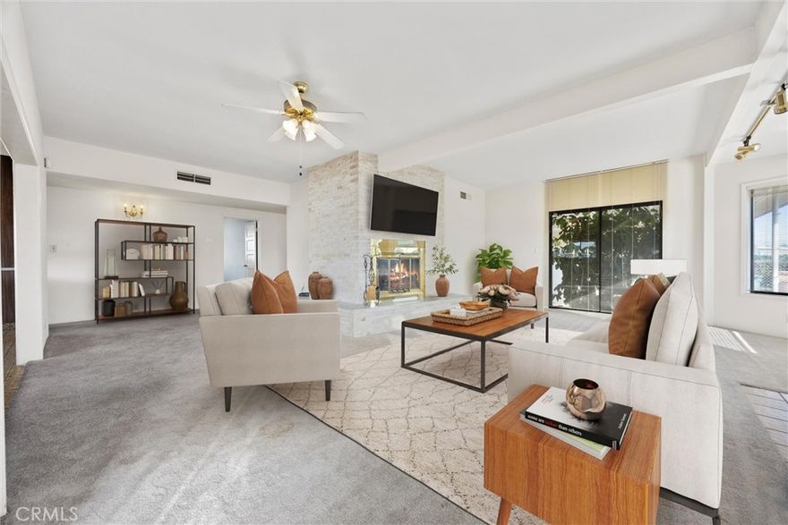 A unique opportunity awaits with this one-of-a-kind corner-lot property showcasing a huge workshop, a thoughtfully designed ADU, and built-in greenhouse that brings indoor–outdoor living to life. The greenhouse is conveniently located just off the entry, offering easy year-round access for gardening, complete with drip system, lighting & drainage for effortless plant care. Inside, a show-stopping floor-to-ceiling wrap-around marble fireplace creates a luxurious statement the moment you walk in. Two bedrooms feature built-in cabinetry for sleek organization, while the indoor laundry area also provides abundant storage space. The detached ADU with its own restroom and tiled shower is ideal for guests, rental income, a private office, or multigenerational living. For hobbyists or those needing substantial workspace, the property has a large workshop attached to the garage, complete with shelving. Outdoors is a very large covered patio and a lush, fully landscaped yard.