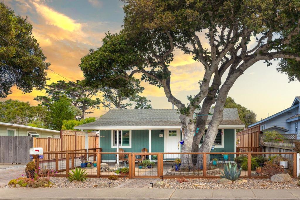 Welcome to your picture-perfect beachside retreat! This super cute and updated 2 bed, 2 bath gem offers approx. 1,038 sqft of cozy charm on a 5,525 sqft lot plus two fully finished bonus sheds (120 sqft each!), perfect for an office, studio, or guest space. Just two blocks from the Coastal Trail and Del Monte Beach, this home brings the vacation lifestyle to your everyday. Enjoy a spacious front porch shaded by a beautiful coastal oak tree perfect for relaxing or greeting neighbors. Inside, discover a remodeled bath, plantation shutters throughout, recessed lighting, modern fans, fresh interior & exterior paint, and custom built-in cabinets. The kitchen features shaker cabinets, a brand new stainless steel refrigerator and Culligan water filter & softener system for pure convenience. Outside, the fully fenced and landscaped yard includes new turf, pavers, a lovely deck, and raised planter boxes. All new exterior doors including a charming front door boost curb appeal and security. Come fall in love with this coastal charmer!