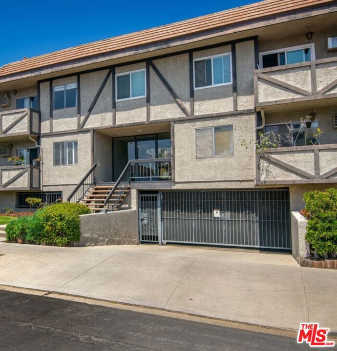 Large bright 2 bedroom 2 bath condo in prime location on an elevated first floor unit. New hardwood laminate floors and recessed lighting along with natural sunlight showcase a warm environment. Large living area opens to an expansive private patio, make it easy for entertaining. Newer kitchen includes high quality stove, refrigerator, microwave & dishwasher. Additional features include two gated tandem parking spaces & a dedicated storage area. Laundry room with several machines on site make it easy to use. Centrally located near UCLA, Westwood, Brentwood, Santa Monica, 20 minutes from the beach, Century City, Beverly Hills. Freeway close to DTLA & LAX