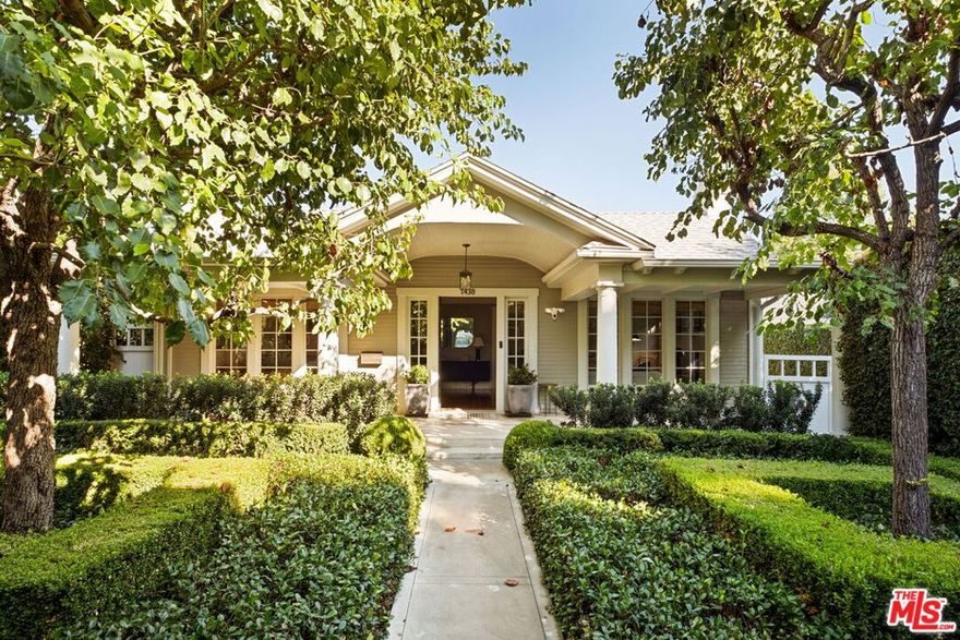 Nestled in the heart of Sunset StripHollywood Hills West, 1438 North Orange Grove is a beautifully preserved Craftsman bungalow that seamlessly blends timeless architecture with modern luxury in Historic Spaulding Square (HPOZ). A gated hedged entry opens to a lush garden oasis framed by manicured boxwoods, mature trees, and white roses creating a tranquil escape from city life. Inside, natural light fills the formal living room, which opens to a versatile office and guest bedroom ideal for hosting visitors or working from home. The elegant dining room flows effortlessly into a bright sitting area, perfect for morning coffee or quiet reading. The home offers 3 bedrooms and 2 bathrooms, including a serene primary suite with marble finishes, a walk-in shower, and generous closet space. The chef's kitchen impresses with a premium Wolf range, marble countertops, stainless steel appliances, and built-in banquette seating. A charming sunroom leads to the private backyard retreat, featuring a grassy lawn, patio, and a detached studio with its own bath ideal for guests, a creative workspace, or an in-law suite. With refined design, lush landscaping, and an unbeatable location, this Spaulding Square gem captures the perfect balance of historic character and contemporary living.