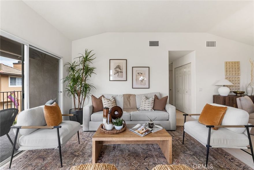 Welcome to 8123 E. Oak Ridge Circle, a beautifully upgraded 2-bedroom, 2-bathroom end unit condo nestled in the highly sought-after Laurelwood community of Anaheim Hills. This thoughtfully designed home offers the ease and flow of single-level living — with all main rooms on one floor — while providing an elevated entry that enhances privacy and 180 degree views. Designed for comfort and style, this move-in ready home offers the perfect balance of modern updates, effortless living, and a serene neighborhood setting. Step inside to discover a bright, open-concept living area filled with natural light and warmth. The spacious floor plan flows seamlessly from the inviting living room into the dining area and refreshed kitchen, complete with brand-new luxury vinyl tile flooring. Every detail has been thoughtfully refreshed — from the fresh paint and plush new carpet to the newer AC unit that enhances the home’s clean, contemporary vibe. The primary bathroom has been tastefully remodeled with sleek, modern finishes, creating a spa-inspired experience you’ll love coming home to. Step outside to your private patio, perfect for morning coffee, evening gatherings, or simply enjoying the peaceful Southern California weather. This home also features an attached two-car garage with ample storage, plus access to the community pools and spas — all surrounded by beautifully maintained green spaces that embody Anaheim Hills’ natural charm. Located near top-rated schools, scenic parks, shopping, and commuter routes, this home offers both serenity and convenience in one of Orange County’s most desirable areas. You’ll also enjoy being just moments from local favorites like Rosine’s Mediterranean Restaurant and Sunbliss Café, both beloved Anaheim Hills icons. Whether you’re a first-time buyer, downsizing, or looking for a low-maintenance investment, 8123 E. Oak Ridge Circle is the perfect place to call home — a rare find that combines style, comfort, and location in one beautiful package.