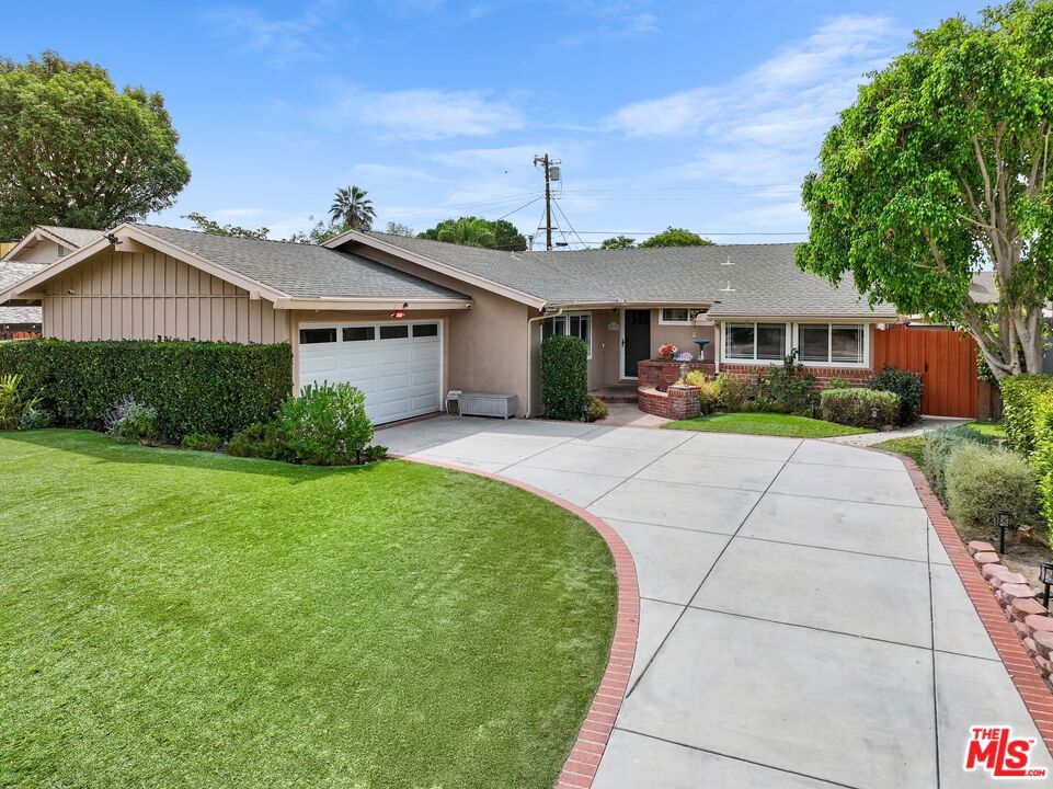 Set in one of Winnetka's most sought-after pockets on a tree-lined street, this 5-bed, 2-bath house welcomes you home with manicured landscaping and a drought-tolerant artificial lawn that combines curb appeal with low-maintenance ease. Inside, vaulted ceilings and clerestory windows create bright, airy living spaces filled with natural light. The kitchen offers granite counters, a spacious pantry and laundry room, stainless steel appliances, and recessed lighting that flows easily into the dining and living areas for both everyday comfort and entertaining. With five bedrooms, there's plenty of flexibility for a growing family, home offices, or guest rooms.Out back, enjoy a private retreat designed for family fun and gatherings, featuring a sparkling pool, shaded patio, and room for kids to play. Recent updates include the AC system and vinyl fencing, and the home features copper plumbing, dual pane windows, plus the convenience of a two-car garage. Enjoy quiet neighborhood living while being just minutes from Westfield Topanga, The Village, Northridge Mall, parks, coffee shops, and dining. This is a wonderful family home with space to work, play, and grow. Don't delay, schedule a showing today!