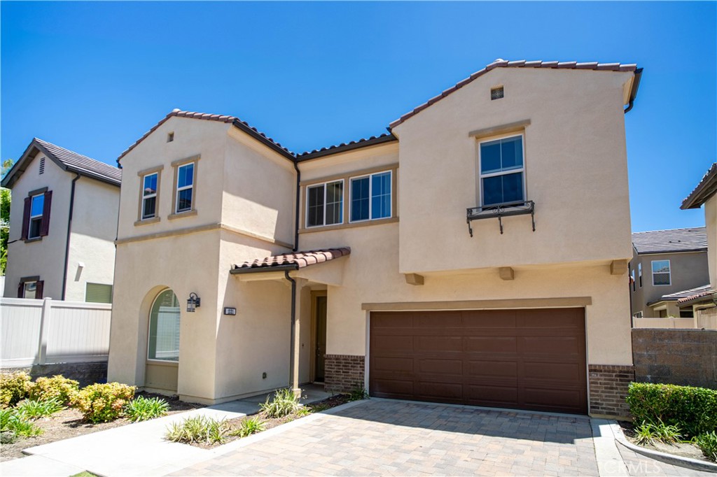 Experience luxury living in the prestigious gated community of Portola Hills. This elegant two-story home showcases 4 BD, 3 BA, a spacious upstairs loft, and a dramatic two-story high ceiling in the great room flood the space with natural light, highlighting the expansive open-concept floor plan ideal for both entertaining and everyday living. Step inside to find a light-filled, open-concept layout with soaring ceilings and expansive windows that create a bright and airy atmosphere. The heart of the home is the stunning great room, seamlessly flowing into the chef-inspired kitchen and dining space, perfect for entertaining or relaxed family living. One full bedroom and bathroom are conveniently located on the main floor, offering ideal accommodations for guests, extended family, or a private home office. The gourmet kitchen features a large center island with seating, quartz countertops, stainless steel appliances, and modern cabinetry, ideal for both casual meals and hosting dinner parties. Upstairs, the loft provides flexible space for a home theater, playroom, or study area. The primary suite is a true retreat with a spa-like en-suite bathroom, walk-in shower, dual sinks, and a large walk-in closet. Two additional secondary bedrooms upstairs share a beautifully appointed bathroom. Additional highlights include a private backyard for outdoor relaxation, a separate laundry room, and a 2-car attached garage. Residents of Portola Hills enjoy access to resort-style amenities including a pool and spa, clubhouse, fitness center, BBQ areas, parks, and scenic hiking and biking trails, all nestled near award-winning schools, shopping centers, restaurants, and commuter routes.
