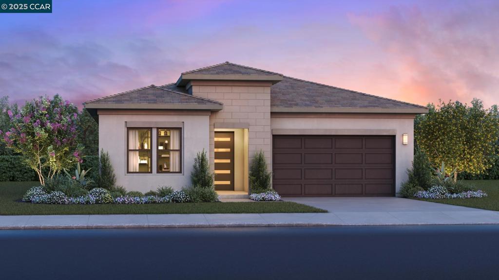 Welcome to Regency at Tracy Lakes, where luxury living takes center stage in this exceptional active adult 55+gated community. Three picturesque lakes, this vibrant community offers a fishing dock, 1-acre community garden and dog park. With a wealth of amenities, including a clubhouse, pools, cabanas, yoga studio, fitness center, bocce ball, and pickleball courts, every day is an opportunity for relaxation and recreation. The onsite lifestyle director ensures there’s always something to look forward to; from fitness classes to comedy shows and wine nights. This home is single-level at its finest. The gourmet kitchen makes a statement with it's premium finishes, including KitchenAid stainless steel appliances, 36" gas cook, modern cabinets, and quartz countertop with complementing backsplash. Luxury vinyl wood plank flooring flows throughout main living space. Elegant craftsmanship with 10-foot ceilings, 8-foot doors, 5 1/4 baseboards, dual-pane Anderson windows, and Western stacking slider doors. Primary bedroom suite complete with an impressive walk-in closet and a spa-like bath with dual vanities, large luxe shower with seat. Bonus flex room or home office extends the possibilities of this home.(photos not of actual home or yard, for marketing only)