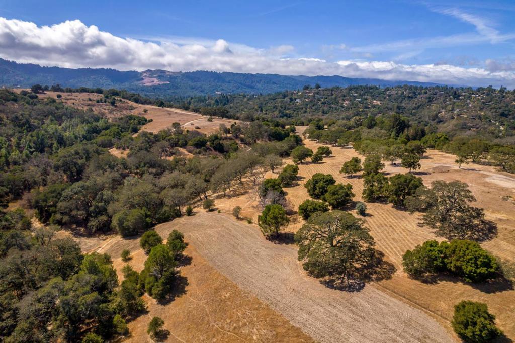 NEW PRICE!!! The existing home on the property was recently demolished to showcase the potential of this magnificent parcel and pave the way for a buyer to build their dream home. Existing utilities onsite already including: water, gas, and electricity. Perc testing has been completed for a new septic system. This is truly a once-in-a-lifetime opportunity. Located at the end of a private road, this magnificent estate lot has spectacular views of Arastradero Preserve open space, San Francisco Bay and the western hills. Located in unincorporated Santa Clara County and part of Palo Alto Unified School District.