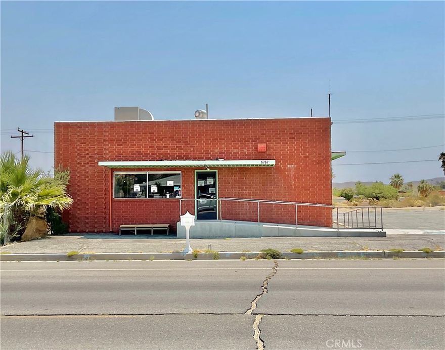 PRIME COMMERCIAL PROPERTY!!  Perfectly located on a corner lot in a high-traffic area of 29 Palms, just minutes from Tortoise Rock Casino, the USMC Marine Base and Joshua Tree National Park.  This is a rare opportunity for entrepreneurs or investors to build their dream business in a location designed for growth and revenue.  This property offers a spacious, open layout with four full loading docs-ideal for deliveries, shipping, and inventory flow.  There is a paved parking lot with ample space for customers and staff, and the building is equipped with forced air, natural gas heat and evaporative cooling, keeping your space comfortable year round.  Zoned for a variety of commercial uses, this building is perfect for retail, distribution, dance studio, beauty salon, barber shop, light manufacturing, event venues, creative spaces, or storage.  With strong visibility and easy accessibility, this property sits in a growing area surrounded by local businesses and constant traffic from residents, military personnel, and tourists.  Bring your business ideas, tour the space and seize this prime opportunity to make your vision a reality!!