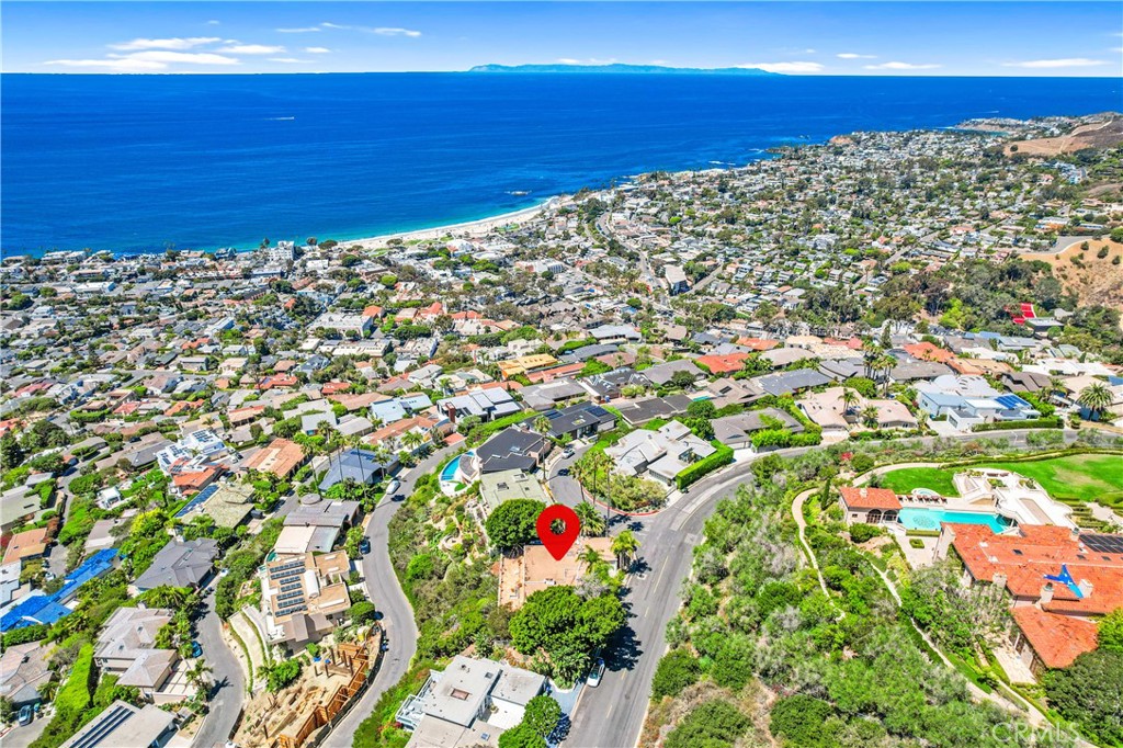 An exceptional opportunity awaits to create a dream ocean-view coastal retreat on a desirable corner lot in Laguna Beach's coveted Mystic Hills neighborhood. With Design Review Board-approved plans by the esteemed architectural firm Anders Lasater, this property is primed for transformation-whether through a striking reimagining of the existing structure or the construction of a brand-new residence. The parcel's elevated topography captures sweeping Pacific vistas, providing a stunning backdrop for inspired coastal living. The current single-level home features three bedrooms and two bathrooms, showcasing mid-century modern design elements, a spacious rear patio, and a private pool and spa-all thoughtfully positioned to embrace the surrounding natural beauty. Mystic Hills is celebrated for its peaceful ambiance while offering effortless access to the very best of Laguna Beach--from iconic beaches and art galleries to renowned dining and entertainment.