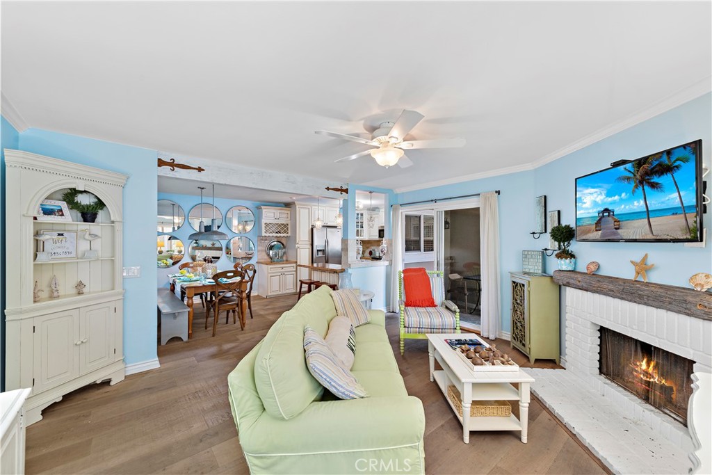 Welcome to this exceptional residence, thoughtfully designed by a professional interior designer and nestled in Dana Point, steps from The Strand beach. Offered fully furnished for short- or long-term lease, this home boasts stunning ocean views and is within walking distance to one of Southern California’s premier beaches. Exuding a sophisticated "cottage chic" ambiance, the property has undergone a comprehensive, high-end renovation with no detail overlooked. Upon entry, you’ll be welcomed by an elegant combination of travertine and wood flooring that enhances the inviting atmosphere. Newly installed windows and doors flood the space with abundant natural light. The gourmet kitchen features custom cabinetry, premium stainless steel appliances, granite countertops, and a bespoke wine rack. Its open-plan design seamlessly connects to the family room, ideal for entertaining and family gatherings. The family room is anchored by a fireplace with a distinctive antique hand-hewn mantle from Virginia, complemented by a 42" LG HD flat-screen TV. Each bedroom includes its own flat-screen television for added comfort and convenience. This coastal retreat offers three outdoor lanais, thoughtfully designed to capture sun, ocean breezes, and breathtaking sunsets throughout the day. The primary bedroom is a luxurious sanctuary, complete with an ocean-view patio and a magnificent four-poster bed draped with a sheer canopy. The en-suite bathroom features elegant double vessel onyx sinks, invigorating body jets in the shower, and intricate custom tile work. Guest accommodations continue the coastal theme, with charming cottage-style bunk beds in one room—comprising a full-sized lower bunk, a twin upper bunk, and an optional air mattress—and a regal four-poster queen bed in the second guest bedroom, offering stunning ocean vistas. Beyond the beautifully appointed interiors, the location is ideal. Situated moments from Salt Creek Beach, Laguna Beach, and the Lantern District Dana Point. The coastal community provides a pool and hot tub mere steps from the condo, perfect for relaxation and embracing the quintessential coastal lifestyle.