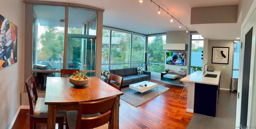 Stunning Corner-Unit 2BR/2BA Condo Directly Across From Petco Park, Bright, Spacious & Beautifully Renovated. Experience downtown San Diego living at its absolute best in this premium corner unit residence offering 1,103 sqft of beautifully renovated living space and exceptional natural light. Located directly across the street from Petco Park, this rare home provides unmatched, front-row stadium views and places you just steps from the heart of the Gaslamp Quarter and downtown’s most vibrant attractions. The open corner layout features high ceilings and two full walls of floor-to-ceiling, double-pane windows that flood the home with sunlight while enhancing privacy and expansive city and stadium views. Upgraded sound-reducing windows keep the interior peaceful and comfortable, even during games and events. Step onto your private balcony overlooking Petco Park, an extraordinary setting for grilling or enjoying baseball games and concerts from your own elevated, VIP-style vantage point. Automatic blinds allow you to shift effortlessly from bright and airy to cozy and private with the touch of a button. Inside, hardwood and tile flooring highlight the main living areas, while plush carpeting in the bedrooms adds warmth and comfort. In-unit washer and dryer and a pet-friendly building ideal for your furry companions. Situated within walking distance to restaurants, nightlife, shopping and the Bayfront, this home offers a rare downtown advantage: an oversized underground parking space that fits two or possibly three vehicles plus a storage unit for bikes, gear, and belongings.!