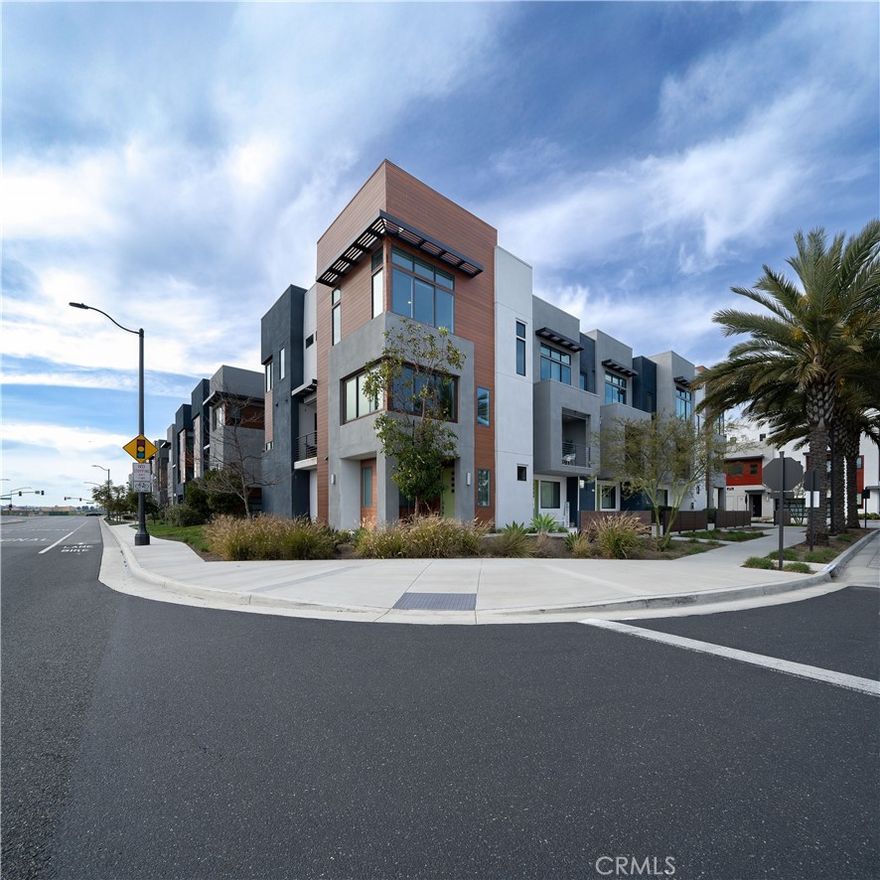 STUNNING MODEL HOME WITH PANORAMIC PARK & MOUNTAIN VIEWS — This beautifully upgraded CORNER UNIT is flooded with NATURAL LIGHT and showcases some of the BEST VIEWS in Tustin Legacy. Over 2,200 SQFT of open living space, only ONE SHARED WALL, and thoughtfully designed finishes make this home truly one of a kind. Enjoy a versatile 4 BED / 3.5 BATH layout, including a private FIRST-FLOOR BEDROOM with a FULL EN-SUITE BATH—perfect for guests or a home office. The MAIN LEVEL offers an expansive great room and a sleek CHEF’S KITCHEN featuring quartz countertops, smart stainless-steel appliances, a generous island, and a covered balcony that frames the PARK & HANGAR VIEWS beautifully. Upstairs, the PRIMARY SUITE is a SHOWSTOPPER, with oversized windows that capture morning light and sweeping views of the park and surrounding landscape. Two additional bedrooms complete the top floor, each offering its own scenic outlook. Located in the desirable Levity Community, this home includes access to RESORT-STYLE AMENITIES—pool, spa, and BBQ area—and is just steps from Victory Park, top-rated schools, and The District at Tustin.