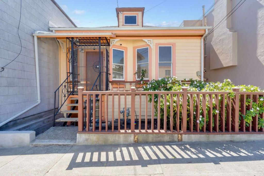 Welcome to this charming Victorian single-family home in Visitacion Valley, featuring 4 spacious bedrooms and 1 bathroom with high ceilings and timeless period details that capture classic San Francisco style. The main level includes 2 bedrooms, 1 bath, hardwood floors in the living and bedroom areas, and a bright bonus sunroom with sweeping city views. The kitchen and bathroom are finished with durable tile flooring designed for everyday use. The lower level offers a large basement with 2 versatile rooms plus a tool storage area, perfect for use as extra bedrooms, a home office, workout space, or hobby area. Recent updates include fresh interior paint. Some upgraded double-pane windows improve comfort and efficiency, while a gated entrance provides both privacy and curb appeal. Conveniently located near HWY 101 with quick access to downtown San Francisco, SFO, and major biotech employers, plus shopping and dining along Leland and San Bruno Avenue. Looking for someone with the vision to create their dream home, this property is ideal for transforming and unlocking its full potential, blending historic charm with modern updates.