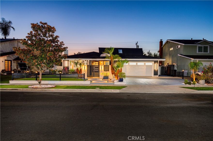 Luxury Living in a warm and intimate setting.  This ranch style home is in the heart of Huntington Beach and has been remodeled and upgraded from top to bottom.  Filled with open natural light yet providing privacy in the huge backyard with a 10’ gazebo and beautifully manicured, seeming to extend into the home through large bifold disappearing doors.  The front and back yards are eco friendly with turf and rock landscaping that requires minimal attention.  The front porch is a serene lounge with privacy sliding doors - just off of the Custom 48” front door.  Now let’s touch on more of this year’s  upgrades:  the kitchen and all three bathrooms are newly remodeled including frameless European custom cabinets & large frameless anti-fog LED light bathroom vanity mirrors.  Prepare gourmet meals in the Wolf range/oven with Wolf hood vent - nestled in the Porcelain Bookmatch Counters that perfectly match the whole slab dining room table.  Pair the perfect wine from your Vinotemp wine cooler.   Three bedrooms with three bathrooms.  Your ensuite master has enormous space and privacy.  This home has a new central AC installed with all new ducting and all new insulation throughout.  Modern large air vents provides whisper quiet comfort.   Enjoy the all new plumbing system and a tankless water heater.  This home is perfect luxury in a highly desirable neighborhood of East Huntington Beach.