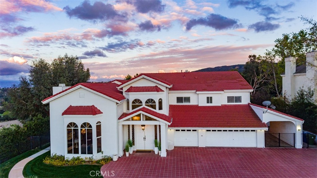 Lease Option to Purchase Available. The Hills of Tarzana with views that go as far as the eye can see! Located on a very private cul-de-sac this custom-built gated home is an entertainer's dream. The estate features an impressive grand entrance hall with an elegant spiral staircase, open plan formal living room and dining room with soaring ceilings. Fresh paint throughout the home. Kitchen has been Remodeled with stove, countertops and farm-style sink. Family room has a built in with wet bar next to the dual glass sliding doors to the backyard. Luxury home sits on a huge lot of land featuring pool and spa, a koi pond with built in waterfall and lush citrus and fruit trees oasis. Primary bedroom has views of the city/ golf course and a balcony to enjoy indoor-outdoor living, has a his and her full bathrooms and his and her closets that are separate areas within the primary suite. Two more bedrooms upstairs each with full bathrooms and in the hallway is a laundry chute to laundry room on first floor. Two bedrooms located downstairs and one full bathroom and guest powder room. Home offers covered boat parking on the side of the home room for an RV not to mention a finished 3 car garage.