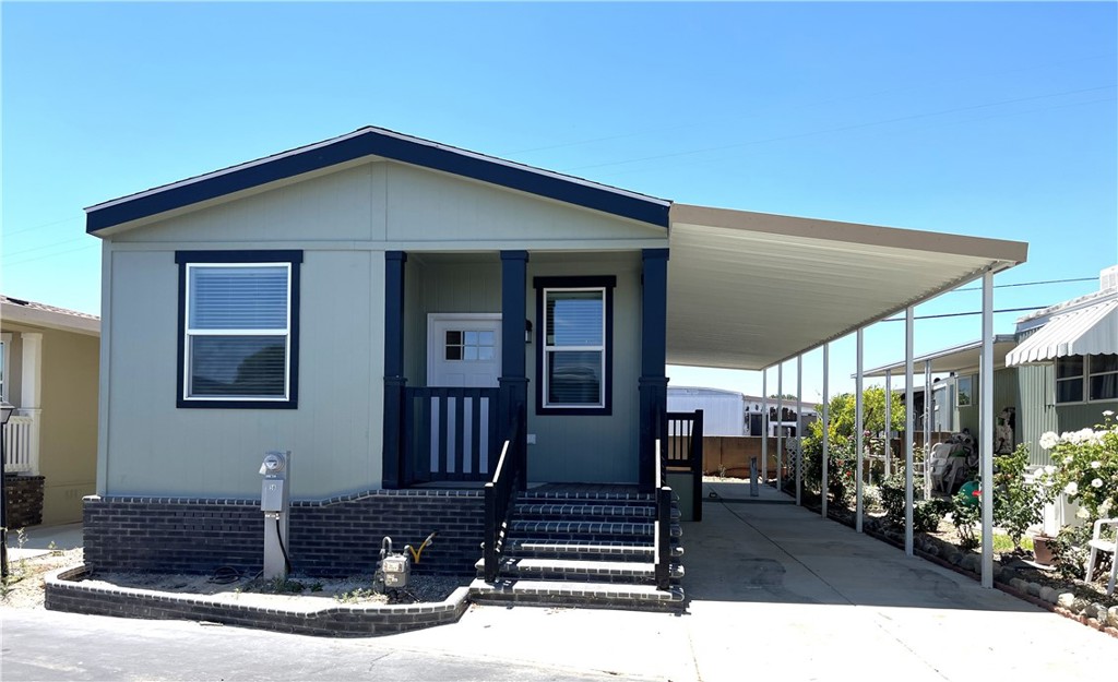 A Brand New Manufactured Home in a Senior Community/55+ Foothill Village. This 2-bedroom and 2-bathroom home has an open floor plan and is approx. 1040 sq. ft. The kitchen is equipped with stainless steel appliances: dishwasher, built-in microwave oven, refrigerator, and oven/range. The laundry room is steps away from the kitchen and has hook-ups for a full-size washer and dryer. The primary bedroom has an adjoining bathroom with a walk-in shower. The home has central a/c and heating, and an attached covered carport.