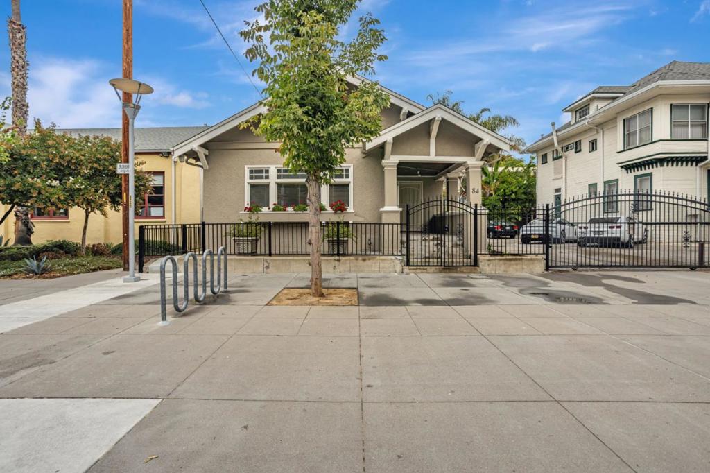 Welcome to this timeless 1920 Craftsman home, ideally situated in the heart of downtown San Jose. Just a short walk to San Jose State University and steps from trendy restaurants, coffee shops, and all the amenities downtown living has to offer. This gated property features classic architectural details including built-in shelves, vintage charm, and a private yard perfect for entertaining or relaxing outdoors. The home offers a versatile floor plan with a spacious dining room and living room that could be easily converted into additional bedrooms, creating a 4-bedroom layout ideal for student housing, short-term rentals, or flexible living arrangements. A basement provides extra storage or potential creative space. With its unbeatable location, character, and investment potential, this home is a rare opportunity for buyers seeking a personal residence near downtown San Jose or an income-producing rental property.