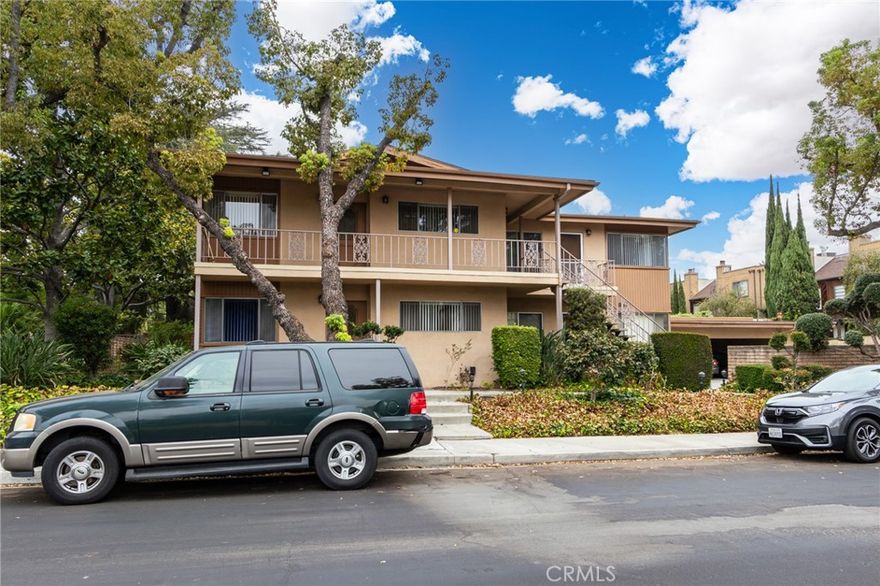 Welcome to this very spacious 2-bedroom, 2-bath, bright corner, single level/ground level apartment in the heart of Arcadia (1 of 4 in complex), featuring an extra-large living room with fireplace and windows facing South and West filling the space with natural light and creating a warm, comfortable atmosphere.  The kitchen has a built-in oven, counter cooktop along with window facing West along with a cozy dining area with breakfast bar and plenty of storage. The dining area also opens to an extra-large private patio which creates an extension of the home and lends itself to indoor/outdoor living. The Primary bedroom features wall-length closets, a ceiling fan, windows facing north and private bath.  The second bedroom features built-in cabinetry and would be perfect for an office or study and also has a ceiling fan and window facing south.  The Guest/Hall Bath has double sinks, a freshly reglazed tub and new lighting.  The home also features central air & heat, laundry facilities on-site and parking for 2 cars.   Freshly painted and new windows throughout have been ordered. The home is walking distance to restaurants, shopping and parks.  It's located a very lovely, desirable neighborhood.  Don't miss your chance to call it home!