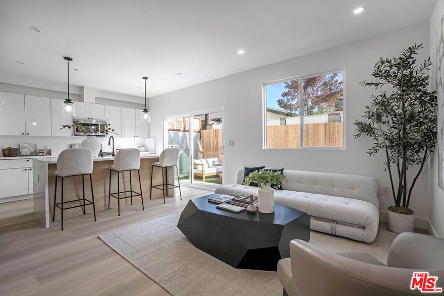 Your golden opportunity to enter homeownership in one of Los Angeles' most rapidly appreciating and design-forward neighborhoods has arrived. Introducing "The David III" a newly constructed 4-bedroom, 3-bathroom rear-unit townhouse within a boutique 3-unit new construction community near the Culver City Arts District. Designed with scale, privacy, and comfort in mind, the open-concept layout connects a beautifully appointed modern kitchen with the living and dining areas, ideal for both daily life and entertaining. The top-floor primary suite spans the entire level and features Baldwin Hills views, a spa-like bathroom, walk-in closet, and a versatile bonus lounge perfect for a home office, gym, or creative space. A defining feature of this home is its enormous private backyard, a rare grassy expanse ideal for dinner parties, weekend gatherings, or letting your kids and pets play freely. Additional highlights include side-by-side parking for two vehicles, consisting of a fully enclosed 1-car garage and dedicated two-car parking area. As an SB-8 exempt property, there is no rent control, offering future owners the freedom to lease without restrictions. Located just minutes from Erewhon, Destroyer, the Helms Bakery District, and major employers like TikTok, Google, Amazon Studios, and Sony, this is a unique opportunity to own a design-forward home with exceptional outdoor space and long-term upside. This is a TIC sale requiring TIC-specific financing or an all-cash purchase. Contact the listing agent for approved TIC lenders and full details.