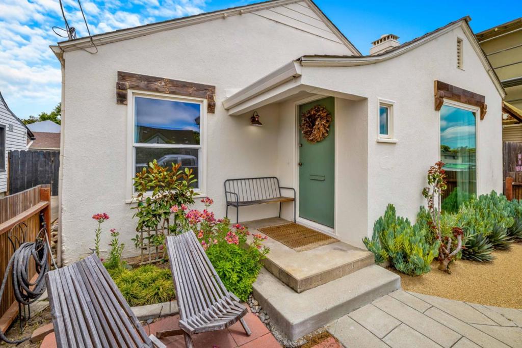 Charming and thoughtfully updated 2-bedroom, 1-bath bungalow in the heart of South Salinas. Upon entering, you'll be greeted by bright, light-filled rooms throughout. The spacious kitchen boasts stylish updates and ample storage, while the original hardwood floors add character and warmth. Outside, enjoy the serene privacy and expansive space, featuring lush gardens in both the front and back yards. Multiple areas provide the perfect setting for entertaining, while the established garden space invites you to grow your own fruits and vegetables. Additional storage options include a large, carpeted overhead attic and exterior storage rooms, offering plenty of room for all your belongings. Ideally situated with convenient access to Hwy 68 and 101, this home is just moments away from all the essentials, including old town shopping, dining, and top-rated South Salinas Schools. Offering the perfect balance of location and convenience, it truly has everything you need!