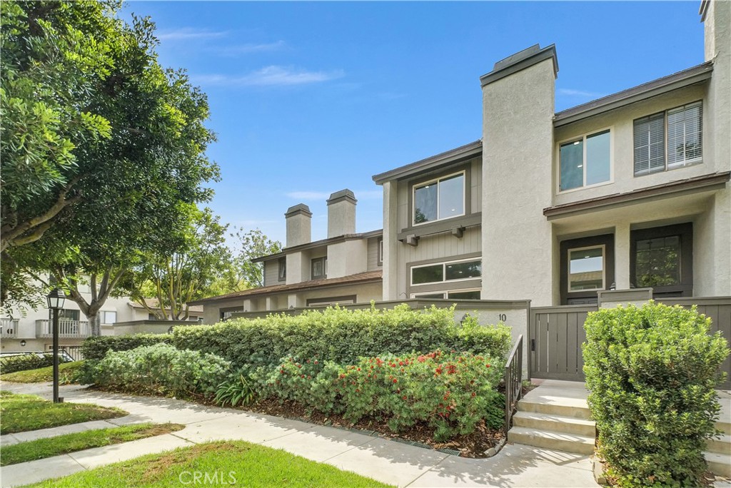 This popular Carmel floor plan is located in the desirable Turtle Rock Meadows community. The beautifully remodeled 3-bedroom, 2.5-bath offers an ideal balance of comfort, style, and functionality—all within one of Irvine’s most cherished neighborhoods. Step into the light-filled living room with its soaring ceilings, cozy fireplace, and direct access to a private front yard—perfect for blending indoor and outdoor living. The newly remodeled kitchen is a chef’s delight, featuring marble countertops, sleek cabinetry, premium stainless steel appliances (including refrigerator, wine cooler, and cappuccino maker), plus a center island with bar seating. A sliding glass door leads to a private deck, ideal for morning coffee or casual dining outdoors. The main level also includes a dining area and a convenient powder room. Upstairs, the spacious primary suite showcases vaulted ceilings featuring custom closet organizers, dual vanities with marble counters. Two additional bedrooms feature custom built-in closet organizers for maximum storage. An attached direct access two-car garage with cabinetry and laundry hookups adds everyday practicality. Newer dual-pained windows, a newer HVAC system, and newer water heater—ensure comfort and efficiency. Community amenities include two resort-style pools, expansive greenbelts, and easy access to Turtle Rock Community Park. Ideally located just minutes from world-class shopping, award-winning schools, beaches, golf, hiking, and dining—with no Mello Roos—this home offers an exceptional opportunity to experience the very best of Irvine living.