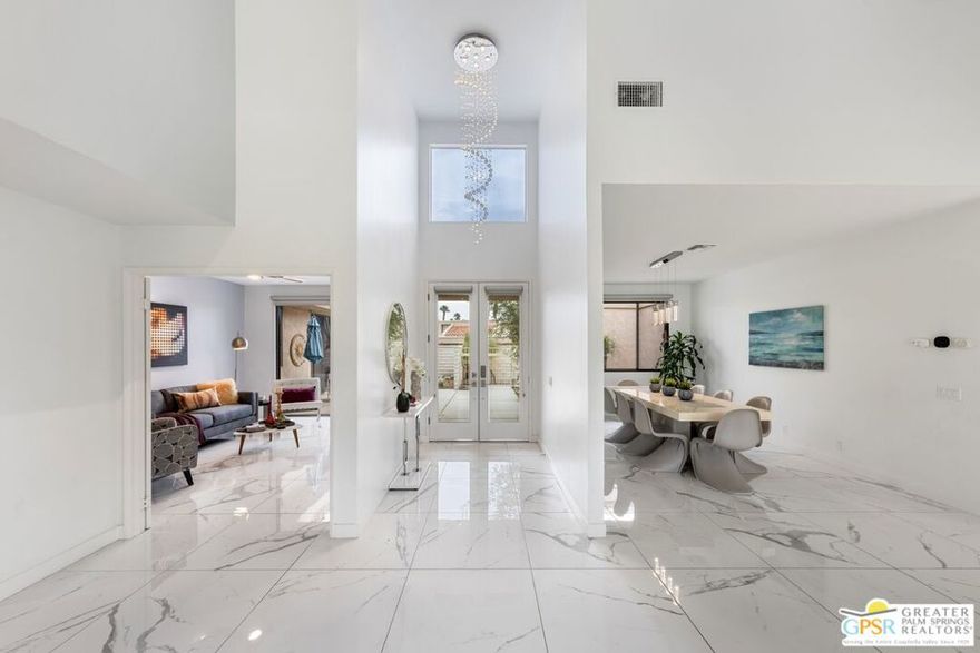 Exceptional Home in Cathedral Canyon Country Club!!!! - This unique residence is one of only twelve homes constructed by the owner and developer of the Club, specifically intended for the personal enjoyment of friends and family. Thoughtfully updated with modern and smart design features, the home offers a blend of comfort and style throughout its layout. Spacious Accommodations - The home features two generously sized suites, each with its own ensuite bathroom, providing privacy and luxury for residents or guests. An additional bedroom includes its own bath, patio, and private entrance offering a perfect retreat for visiting guests. The fourth bedroom or den conveniently opens to the front courtyard, creating a flexible space that can serve as an office, guest room, or relaxation area. Open Living Spaces - At the heart of the home is a large open great room, which seamlessly flows into a well-designed kitchen highlighted by a distinctive blue theme. This layout is ideal for both entertaining and everyday living, fostering a welcoming atmosphere for gatherings with family and friends. Prime Location and Outdoor Living - Conveniently situated between Palm Springs and Palm Desert, the property is within easy reach of a variety of shopping, dining, and entertainment options. The expansive back patio is equipped with electric retractable awnings and a misting system, making it an exceptional setting for outdoor entertaining or quiet relaxation. From here, enjoy spectacular views of the greens, lake, and surrounding mountains, enhancing the home's appeal and providing a picturesque backdrop for every occasion.  One of 2 community pools are just steps away but not imposing on the view!!