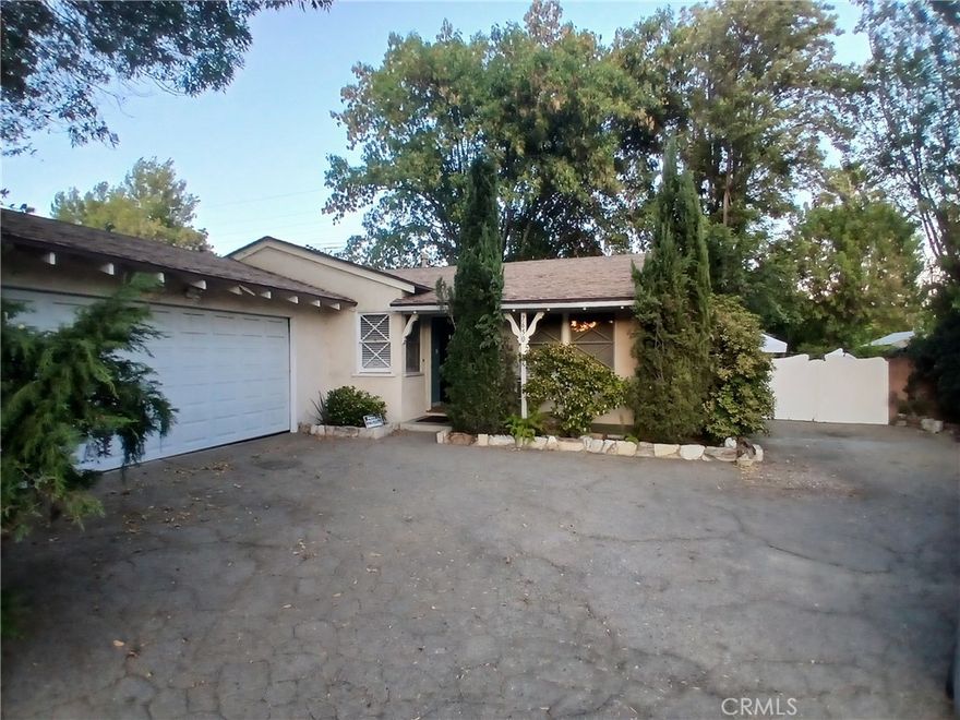 Welcome to this charming single-story ranch home located in the highly sought-after Reseda Ranch neighborhood. Offering 3 bedrooms and 1.5 bathrooms across 1,476 sq. ft. of living space, this residence sits on an expansive 15,979 sq. ft. lot, providing both comfort and versatility. Inside, you’ll find a bright and inviting living room, complemented by a spacious family room with a private entrance—ideal for a den, home office, or potential fourth bedroom. Recent updates, including new flooring and ongoing maintenance, ensure the home is well cared for and move-in ready. The backyard is designed for true California living, featuring a generous patio area perfect for entertaining, outdoor dining, or simply unwinding. Additional amenities include a 2-car garage, RV access, and a wide driveway for ample parking. Highlights include central air conditioning, landscaped front and rear gardens, and a convenient location near schools, shopping, and major freeways. Don’t miss this opportunity to own a beautifully maintained home on an oversized lot in one of Reseda Ranch’s most desirable pockets.