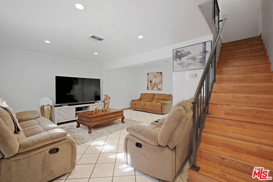 Welcome to this bright and beautifully updated two-story townhome in a quiet, gated community where there's no one above or below you, and every space feels open, private, and thoughtfully designed. From the moment you step inside, you're greeted by streams of natural light, warm tones, and a layout that's as functional as it is inviting. The main level offers a seamless open-concept living and dining area ideal for both relaxing evenings and effortless entertaining. The kitchen has been tastefully renovated with modern quartz countertops, clean-lined contemporary cabinetry, and a cozy breakfast nook that quickly becomes your favorite spot for morning coffee or catching up over a casual meal. Upstairs, you'll find two generously sized en-suite bedrooms, each with its own full bath, offering comfort and privacy for family or guests. The primary suite features soaring cathedral ceilings and dual closets, giving you extra breathing room and ample storage. An in-unit laundry area is conveniently located on the upper level, while a powder room on the main floor keeps guests comfortable without disturbing your private spaces above. Additional features include gated, tandem two-car parking located directly beneath the unit for maximum convenience, plus low HOA dues of just $275, both value and peace of mind. Perfectly situated for commuters, this home is just minutes from the 405 and 170 freeways, the Van Nuys Metrolink Station, and the shops, dining, and entertainment at NoHo West. Local parks and community amenities are also close by, adding even more to love about the location. This turnkey townhome checks every box: style, function, comfort, and location. Come see it for yourself and feel right at home.