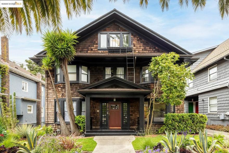 Nestled on a cozy treelined street in the historic Elmwood district, 2910 Hillegass Avenue offers comfort, charm, and convenience.  A professionally landscaped garden and sprawling front porch welcome you to this classic brown shingle home – a hallmark of Berkeley’s rich architectural history. The building comprises 4 separate units, each with their own private deck and storage area.  Inside, you’ll be charmed by high ceilings, original hardwood floors, and a row of bay windows providing ample natural light.   The entire unit has been tastefully updated with modern comforts, including central air conditioning,  upgraded furnace, new water heater (2023), and thoughtful soundproofing. The meticulously renovated kitchen includes custom soft-close cabinetry, painted ceramic tiles, and stone countertops. Saltillo floor tile provides warmth and character. The bathroom features Porcelanosa tiles, a concrete-topped custom vanity, and an extra-quiet exhaust fan. Sliding glass doors lead out to the sunny rear deck.  Located in Berkeley’s sought after Elmwood district just minutes to College Avenue, UC campus, and Rockridge BART. With a neighborhood WalkScore® of 96, Elmwood provides easy access to an array of amenities. It is also conveniently situated near several beautiful nature spaces.